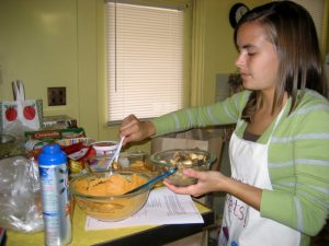 Sara making the lasagna