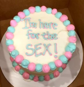 Gender reveal cake with words I'm here for the sex!